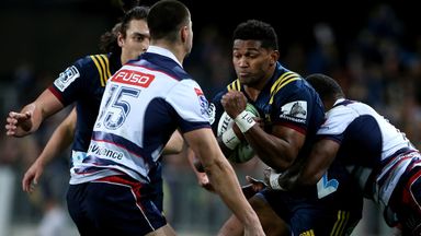 Waisake Naholo of the Highlanders fends off the Rebels' Jack Maddocks
