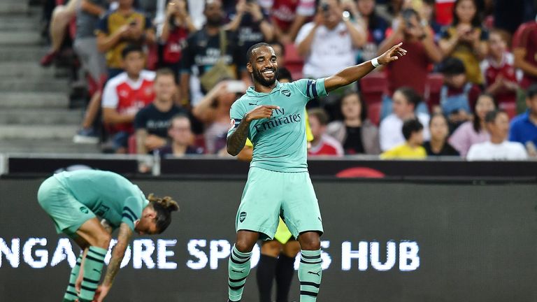 Alexandre Lacazette celebrates after scoring against PSG