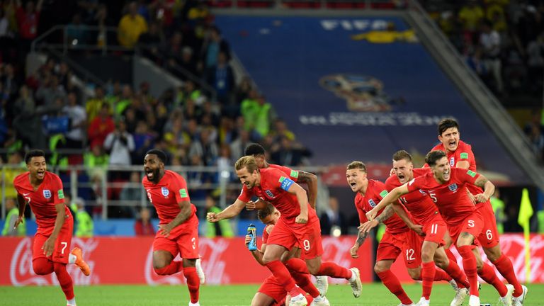 England players celebrate after Eric Dier's spot kick seals a 4-3 penalty shootout victory over Colombia