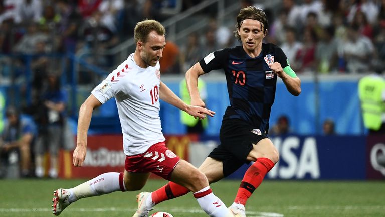 Christian Eriksen and Luka Modric battle for possession