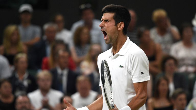 Serbia's Novak Djokovic reacts against Spain's Rafael Nadal during their men's singles semi-final match on the eleventh day of the 2018 Wimbledon Championships at The All England Lawn Tennis Club in Wimbledon, southwest London, on July 13, 2018.