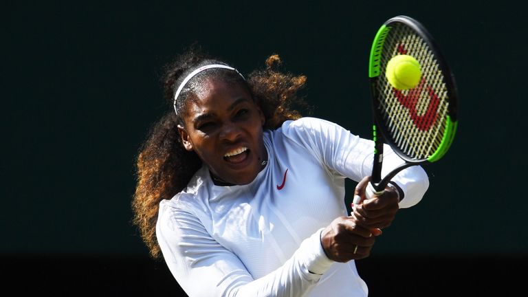 Serena Williams hits a backhand