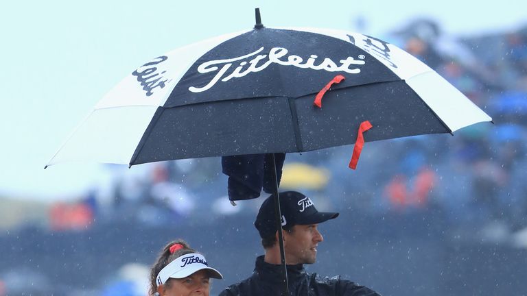Adam Scott and caddie Fanny Sunesson were out in the rain at Carnoustie on Friday morning