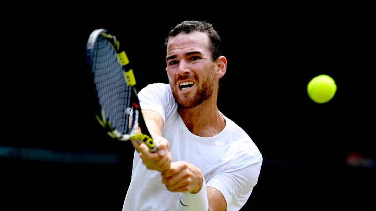 Adrian Mannarino of France plays a backhand against Roger Federer of Switzerland during their Men's Singles fourth round match on day seven of the Wimbledon Lawn Tennis Championships at All England Lawn Tennis and Croquet Club on July 9, 2018 in London, England