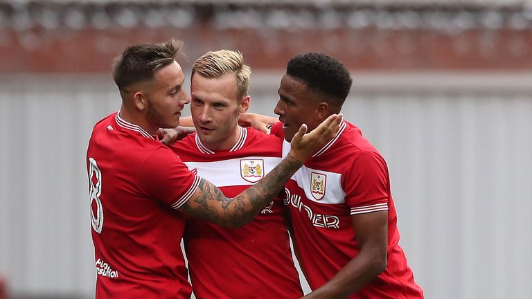 Bristol City's Andreas Weimann (centre) celebrates scoring his side's first goal of the game with Josh Brownhill (left) during a pre-season friendly match at Ashton Gate