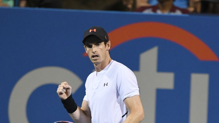 Andy Murray celebrates winning a point against Mackenzie McDonald