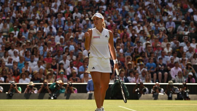 Angelique Kerber celebrates winning the first set against US player Serena Williams during their women's singles final match on the twelfth day of the 2018 Wimbledon Championships at The All England Lawn Tennis Club in Wimbledon, southwest London, on July 14, 2018