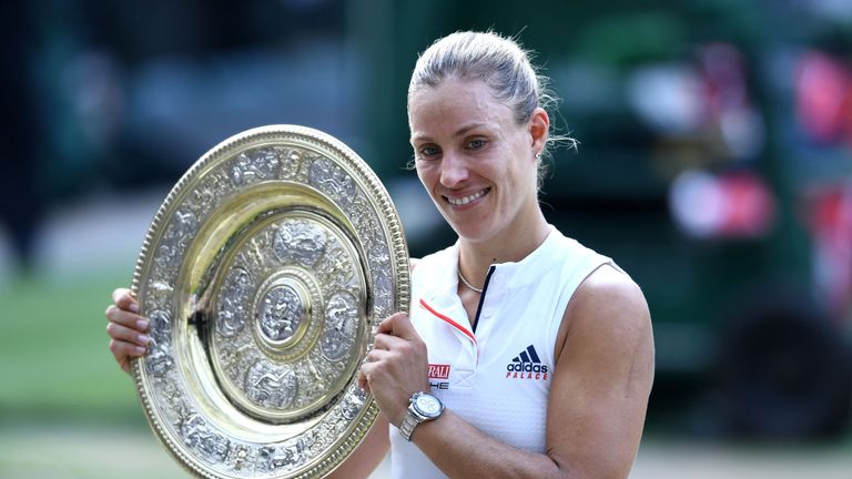 Angelique Kerber of Germany poses with the Venus Rosewater Dish after defeating Serena Williams of The United States in the Ladies' Singles final on day twelve of the Wimbledon Lawn Tennis Championships at All England Lawn Tennis and Croquet Club on July 14, 2018 in London, England.