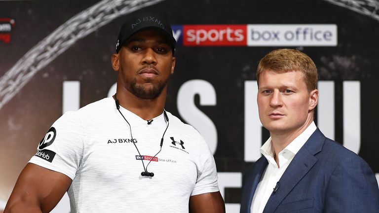Anthony Joshua goes head to head with Alexander Povetkin during a press conference at Wembley Stadium on July 18, 2018