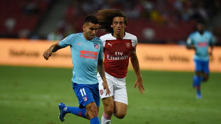 Angel Correa shields the ball from Matteo Guendouzi in the first half