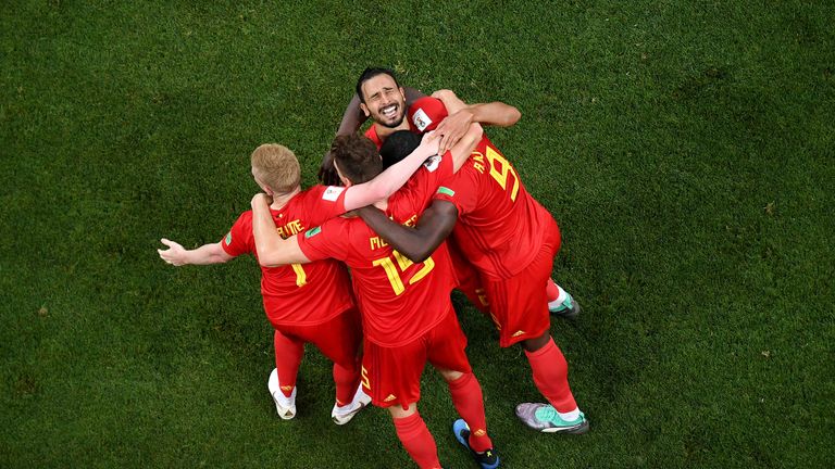 Belgium players celebrate Nacer Chadli&#39;s late winner against Japan in the World Cup last 16