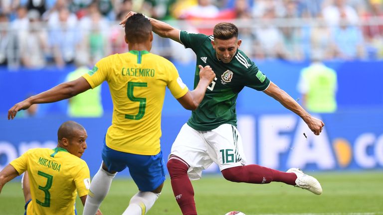 Brazil's Casemiro blocks a shot from Mexico's Hector Herrera at the 2018 World Cup last-16 tie in Samara, Russia.