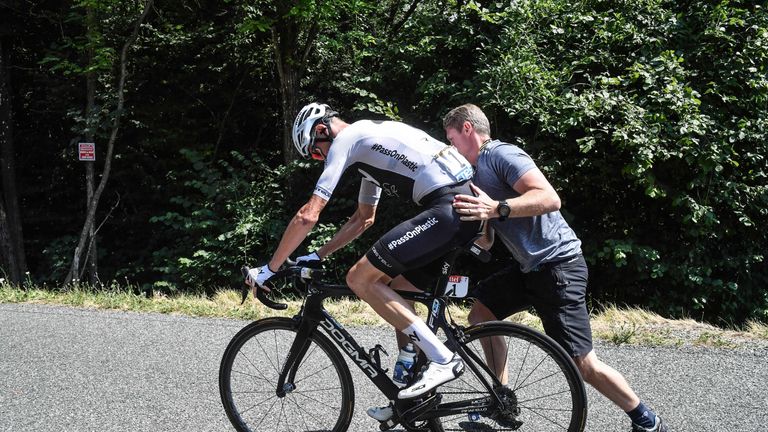Chris Froome suffered a puncture on the short gravel section on the Montée du Plateau des Glières