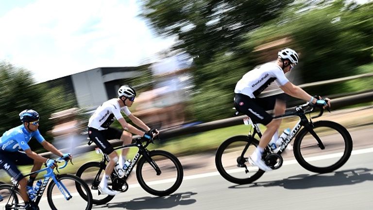 Chris Froome (middle), sporting the scars of Saturday's drama, avoided the crashes on Sunday