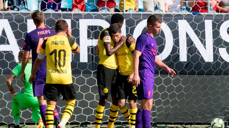 Borussia Dortmund&#39;s Christian Pulisic (2nd R) celebrates scoring a goal from a free kick
