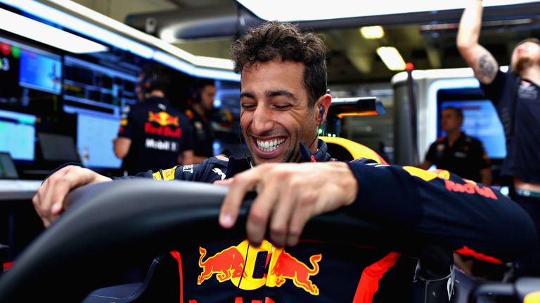 A grinning Daniel Ricciardo prepares to drive in practice for the Formula One Hungarian Grand Prix at Hungaroring on July 27, 2018