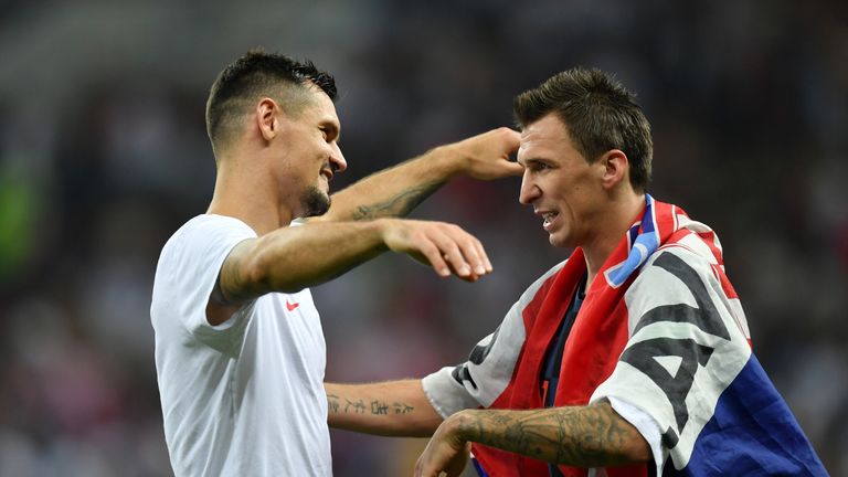 Lovren celebrates with match winner Mario Mandzukic after extra-time goal fires Croatia into World Cup final