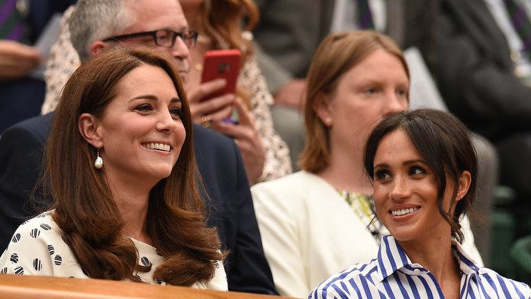 Britain's Catherine, Duchess of Cambridge, (L) and Britain's Meghan, Duchess of Sussex take their seat in the Royal box on Centre Court before watching Serbia's Novak Djokovic play against Spain's Rafael Nadal during the continuation of their men's singles semi-final match on the twelfth day of the 2018 Wimbledon Championships at The All England Lawn Tennis Club in Wimbledon, southwest London, on July 14, 2018