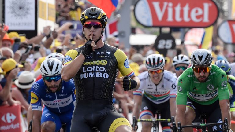 Dylan Groenewegen celebrates as he crosses the line to win stage seven in Chartres