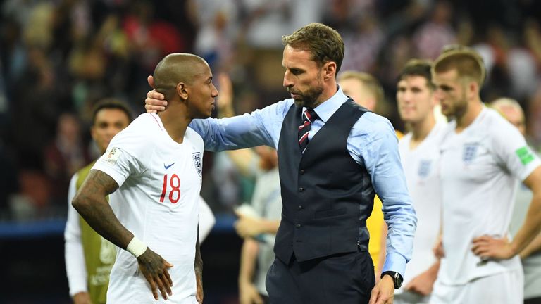 England's coach Gareth Southgate (R) comforts England's defender Ashley Young at the end of the Russia 2018 World Cup semi-final football match between Croatia and England at the Luzhniki Stadium in Moscow on July 11, 2018. 