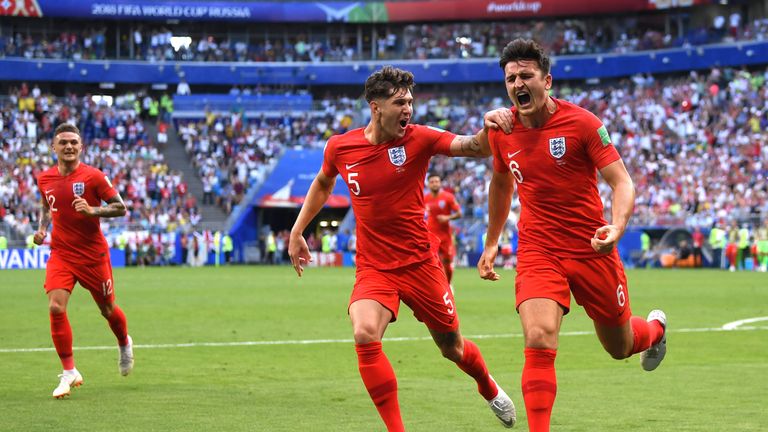 Harry Maguire celebrates his goal for England against Sweden with John Stones