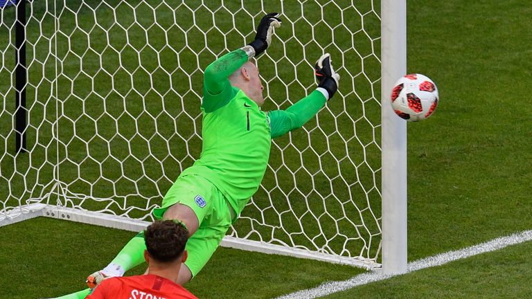 England's goalkeeper Jordan Pickford dives for the ball during the Russia 2018 World Cup quarter-final football match between Sweden and England at the Samara Arena in Samara on July 7, 2018.