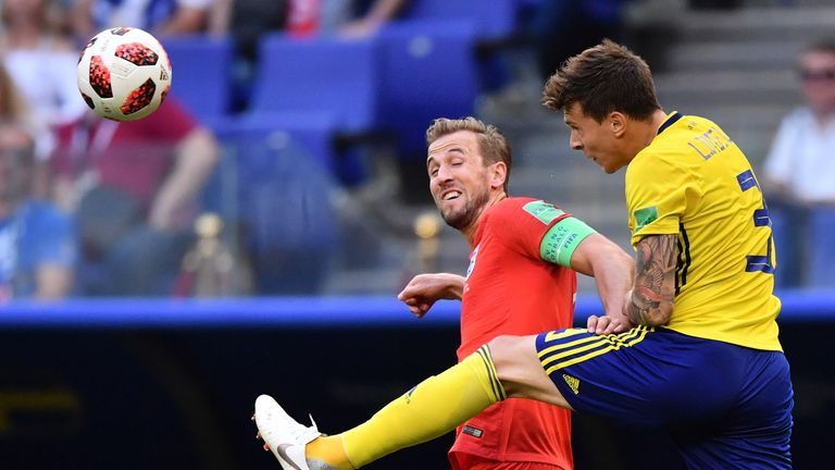 England's forward Harry Kane (L) heads the ball with Sweden's defender Victor Lindelof during the Russia 2018 World Cup quarter-final football match between Sweden and England at the Samara Arena in Samara on July 7, 2018.