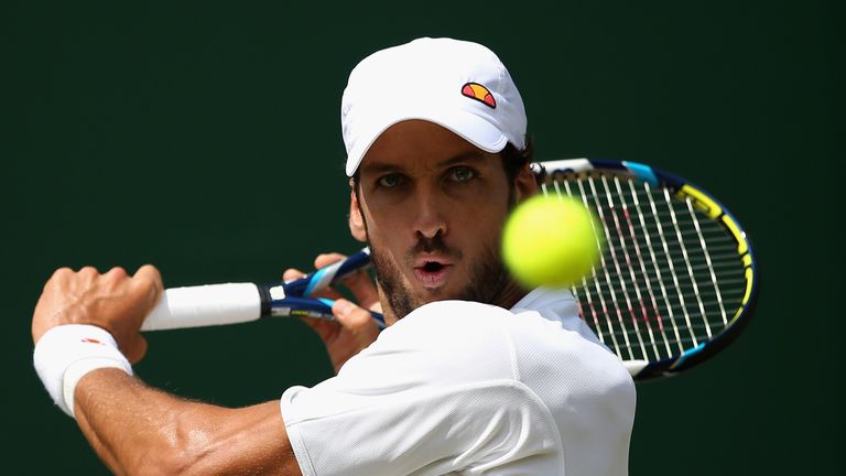 Feliciano Lopez of Spain plays a backhand during his Gentlemen's Singles second round match against Nikoloz Basillashvili of Georgia during day four of the Wimbledon Lawn Tennis Championships at the All England Lawn Tennis and Croquet Club on July 2, 2015 in London, England