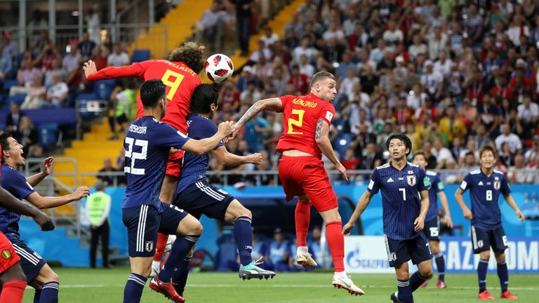 Marouane Fellaini rises to head Belgium level during a breathless second half