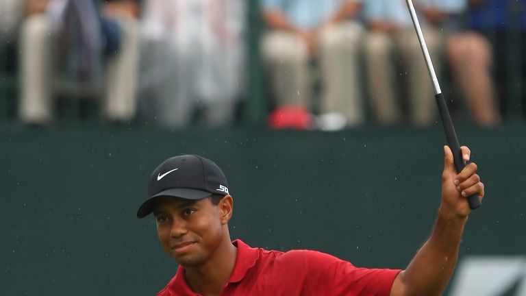 Tiger Woods celebrates on the 18th hole after winning the WGC-Bridgestone Invitational August 5, 2007 at Firestone Country Club in Akron, Ohio.