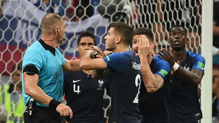 France's players ask Argentine referee Nestor Pitana (L) for a VAR review during the Russia 2018 World Cup final football match between France and Croatia at the Luzhniki Stadium in Moscow on July 15, 2018