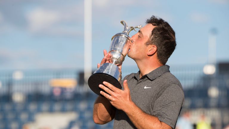 Italy's Francesco Molinari celebrates his win in The Open with the Claret Jug