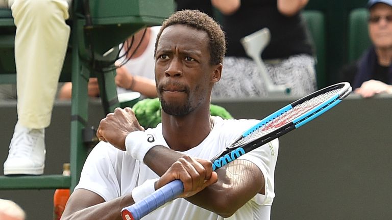 France's Gael Monfils celebrates after beating Italy's Paolo Lorenzi 3-6, 6-3, 7-6, 7-6 in their men's singles second round match on the third day of the 2018 Wimbledon Championships at The All England Lawn Tennis Club in Wimbledon, southwest London, on July 4, 2018.