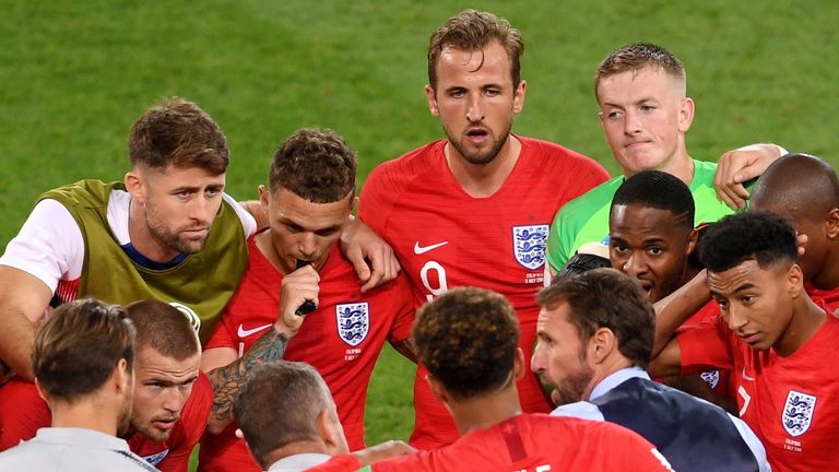 Gareth Southgate speaks to his players at the end of normal time