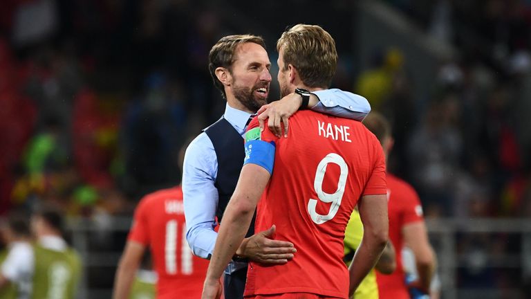 Gareth Southgate embraces captain Harry Kane after the game