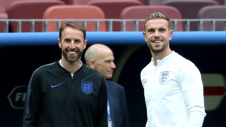 Gareth Southgate, Manager of England speaks with Jordan Henderson of England during a pitch inspection during the England Press Conference at the Luzhniki Stadium on July 10, 2018 in Moscow, Russia