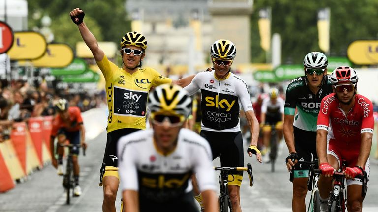 Geraint Thomas crosses the line alongside Chris Froome to win Tour de France