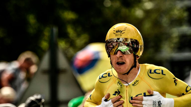 Geraint Thomas celebrates as he crosses the line on stage 20