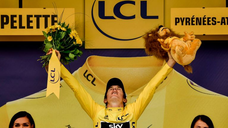 Geraint Thomas celebrates after confirming his victory in the Tour de France on stage 20