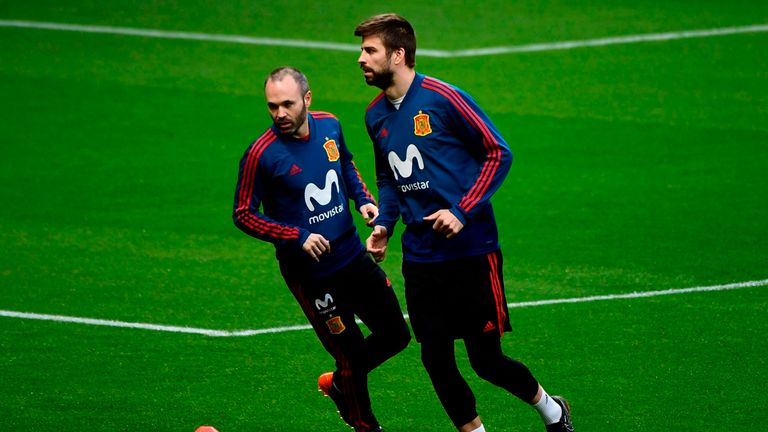 Andres Iniesta (L) and Gerard Pique (R) have retired from international football