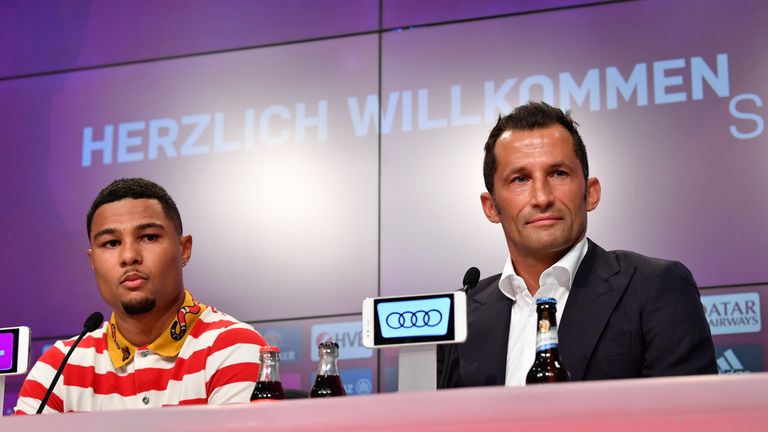 Gnabry sat with Bayern's sports manager Hasan Salihamidzic at his unveiling