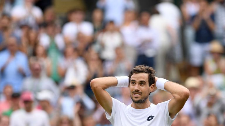 Argentina's Guido Pella reacts after winning against Croatia's Marin Cilic during their men's singles second round match on the fourth day of the 2018 Wimbledon Championships at The All England Lawn Tennis Club in Wimbledon, southwest London, on July 5, 2018. - Pella won the match 3-6, 1-6, 6-4, 7-6, 7-5. 