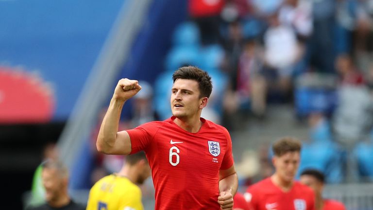 Harry Maguire celebrates scoring against Sweden