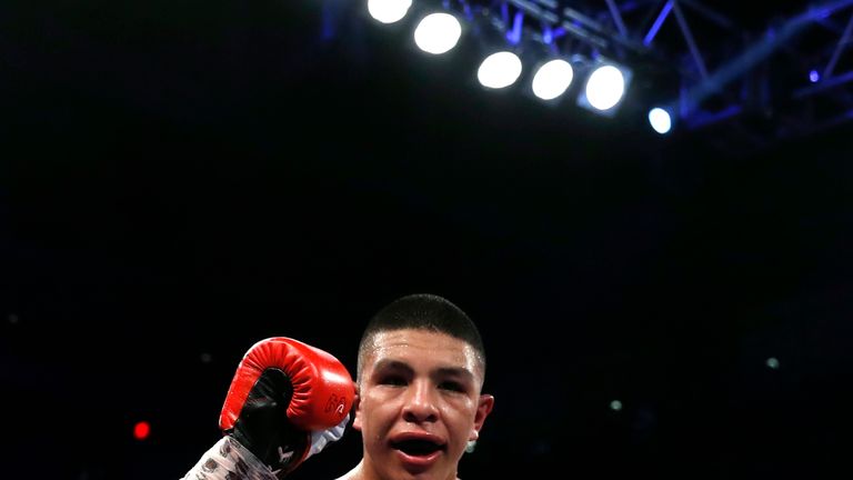 WBO junior middleweight champion Jaime Munguia of Mexico celebrates his unanimous decision victory over Liam Smith of England in Las Vegas