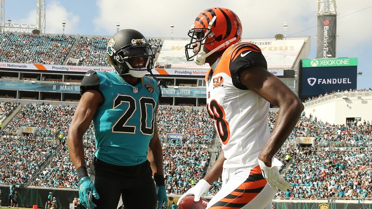 JACKSONVILLE, FL - NOVEMBER 05:  A.J. Green #18 of the Cincinnati Bengals and Jalen Ramsey #20 of the Jacksonville Jaguars discuss a play in the first half of their game at EverBank Field on November 5, 2017 in Jacksonville, Florida.  (Photo by Logan Bowles/Getty Images)