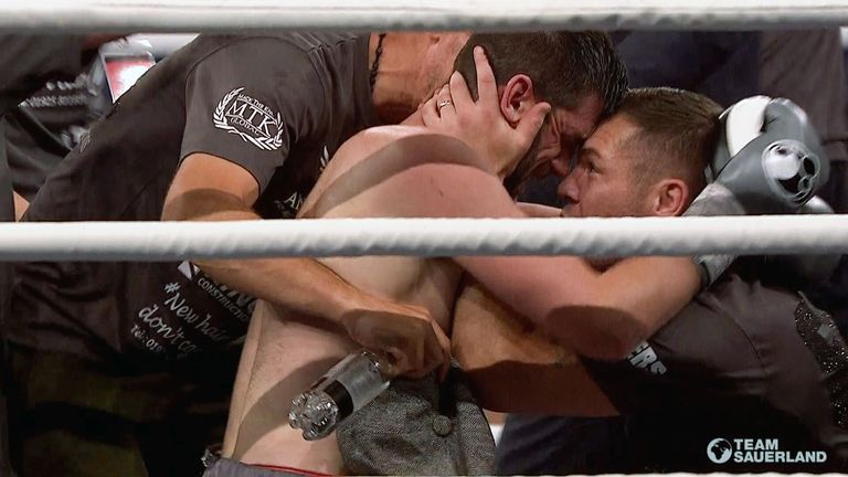 Rocky Fielding celebrates his world-title win with trainer Jamie Moore