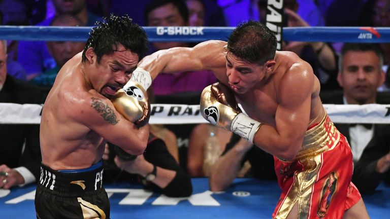 Manny Pacquiao and Jessie Vargas in the xx round of their WBO welterweight championship fight at the Thomas & Mack Center on November 5, 2016 in Las Vegas, Nevada. Pacquiao won by unanimous decision..