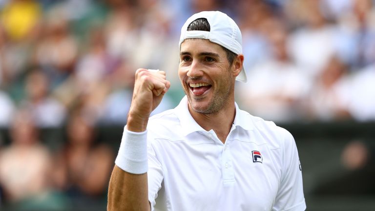 John Isner of The United States celebrates a point against Kevin Anderson of South Africa during their Men's Singles semi-final match on day eleven of the Wimbledon Lawn Tennis Championships at All England Lawn Tennis and Croquet Club on July 13, 2018 in London, England