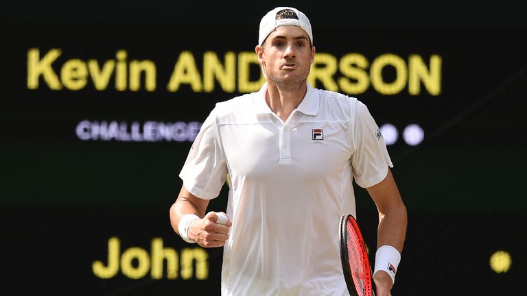 US player John Isner celebrates winning the third set against South Africa's Kevin Anderson during their men's singles semi-final match on the eleventh day of the 2018 Wimbledon Championships at The All England Lawn Tennis Club in Wimbledon, southwest London, on July 13, 2018.