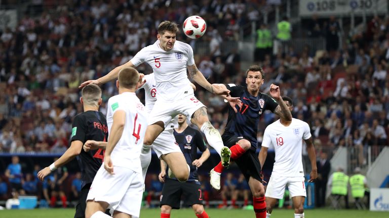 John Stones directs his header towards goal where it's cleared off the line by Sime Vrsaljko